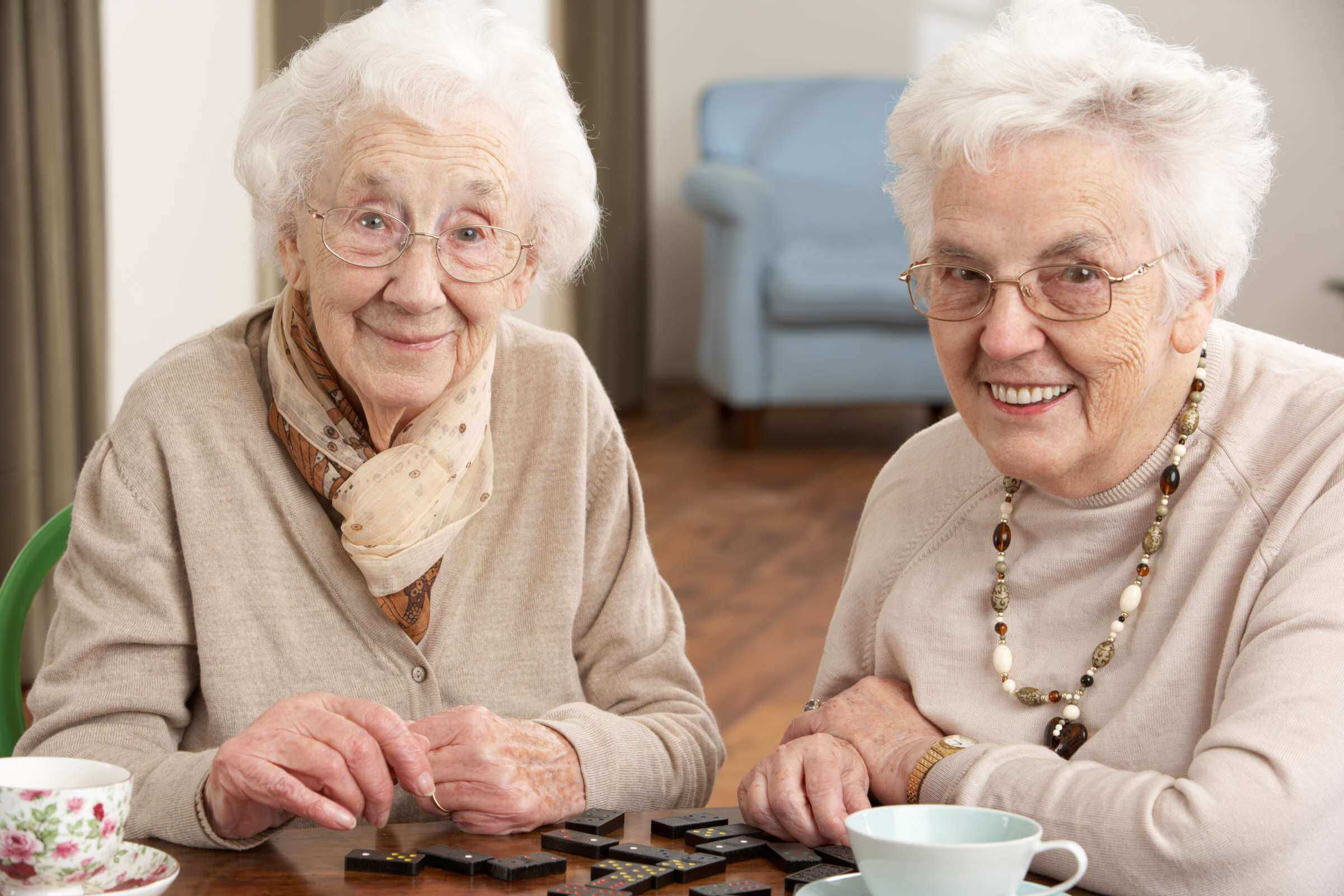 Two smiling senior women in aged care